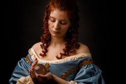 Baroque woman with glass ball
