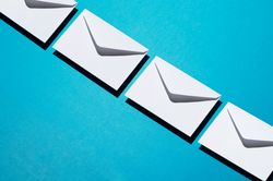 Light envelopes over teal background