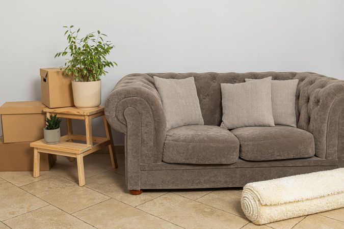 Moving concept, sofa and things in boxes