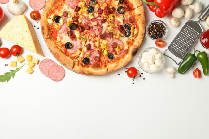 Tasty pizza and ingredients on neutral background, space for text