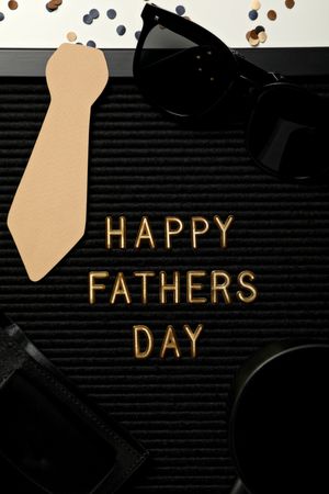 Inscription on a board for Father's Day, on a light background.