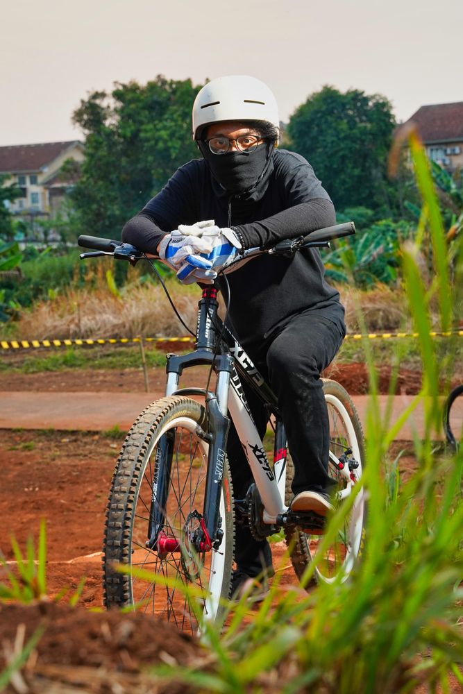 Man on bike with helmet outdoor