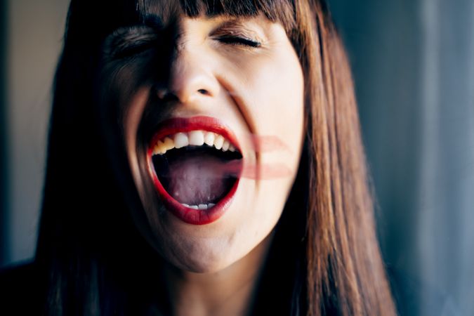 Stylish woman kissing glass