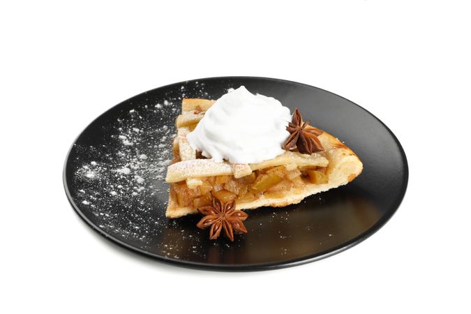 Plate with piece of apple pie isolated on plain background