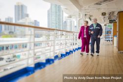 Mature Couple Enjoying The Deck of a Cruise Ship bYqdld