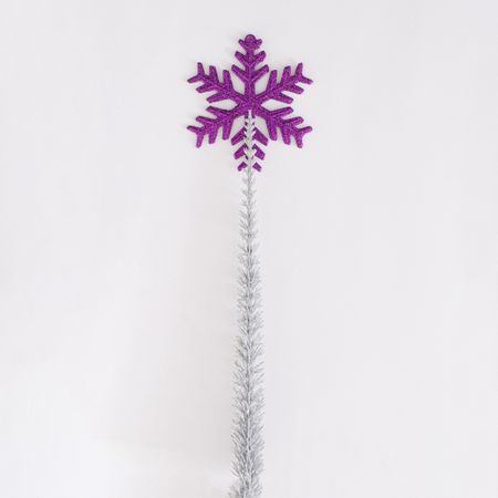 Violet snowflake on a silver frozen branch