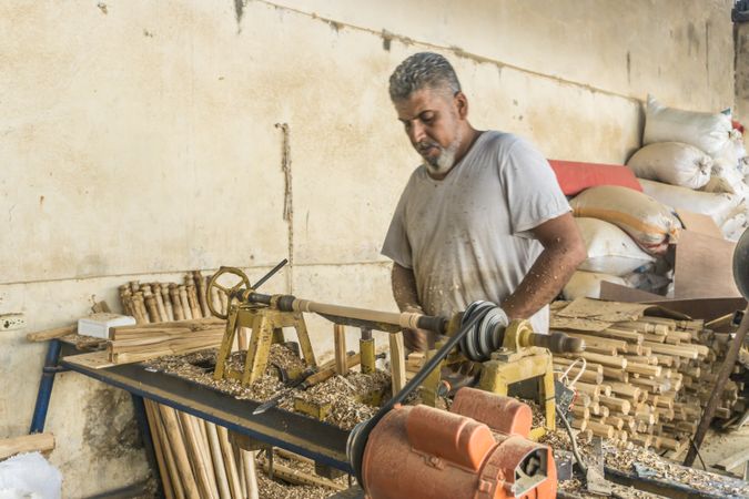 Man using woodworking machine at workplace