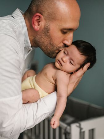 Father hugging cute baby