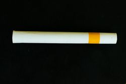 Cigarette on dark background