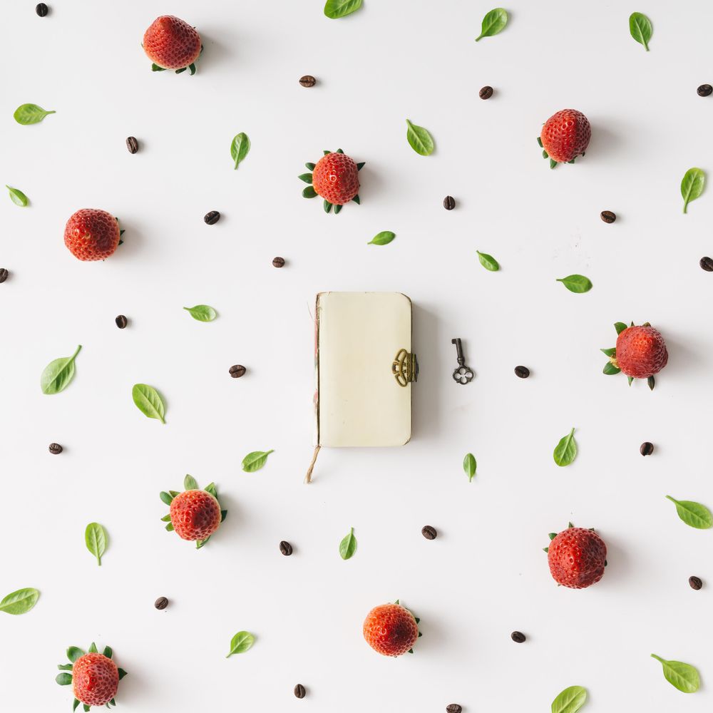 Pattern with strawberry, leaves and notebook
