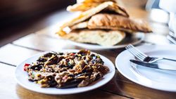 Traditional Georgian eggplant dish with vegetable served on a cafe table