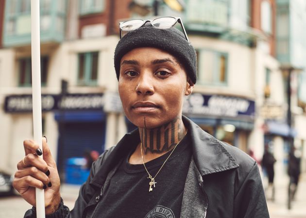 London, England, United Kingdom - June 6th, 2020: Tattooed woman holding sign