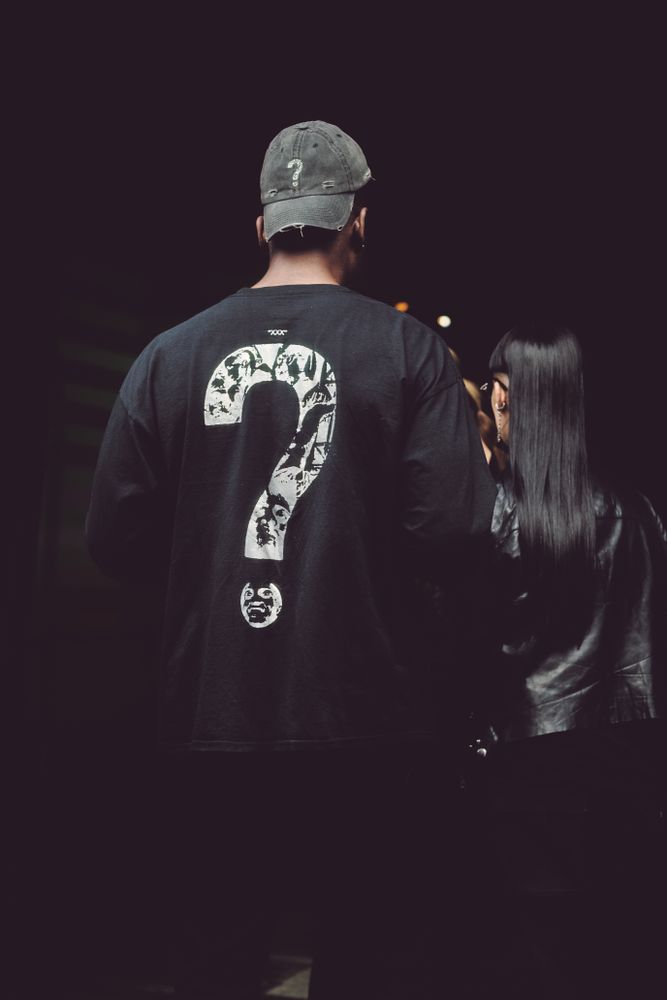 London, England, United Kingdom - September 18 2021: Back of man with question mark on back