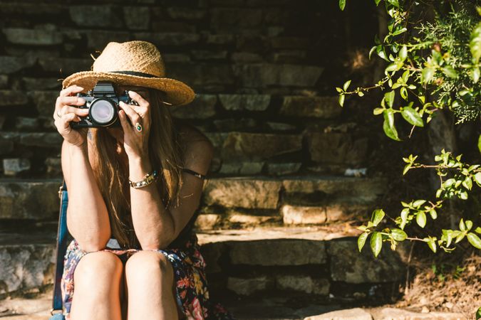 Woman with photo camera on street