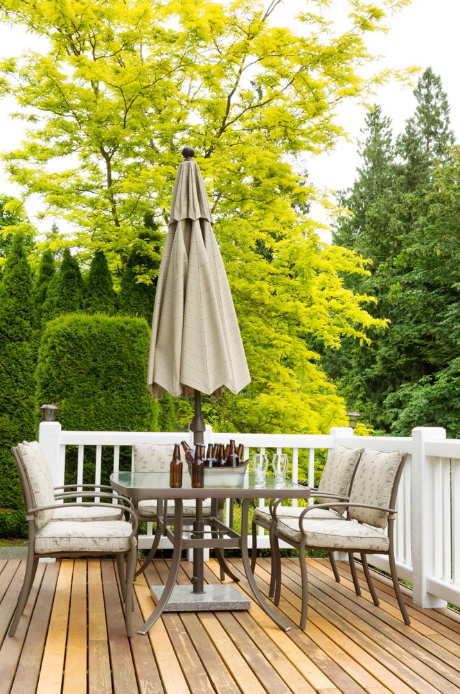 Cold bottled beer on outdoor patio table
