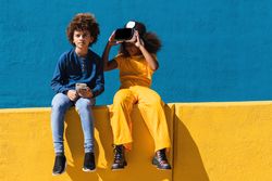 Black teenagers using modern gadgets