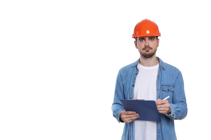 Engineer in helmet with folder, isolated on light background, space for text