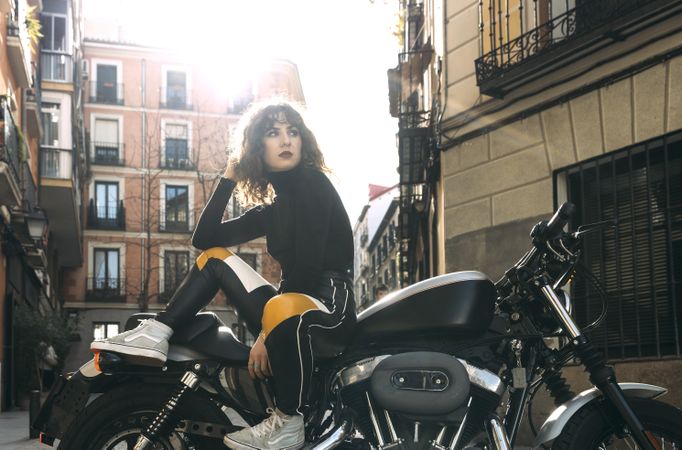 Young woman in custom motorbike