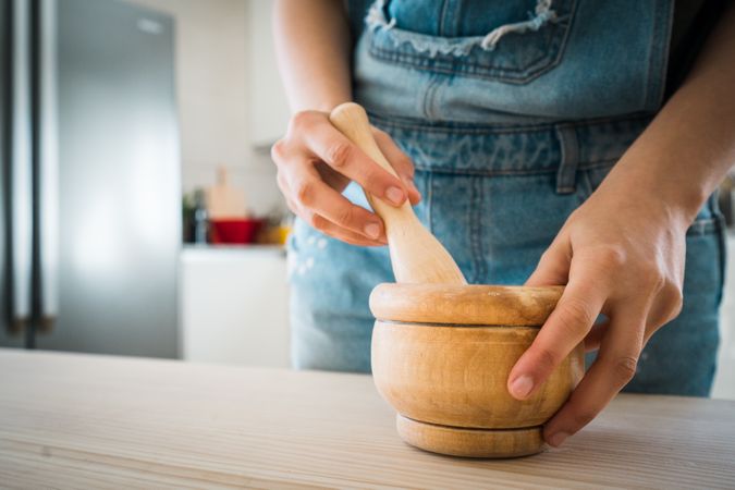 Mortar and pestle on table in kitchen