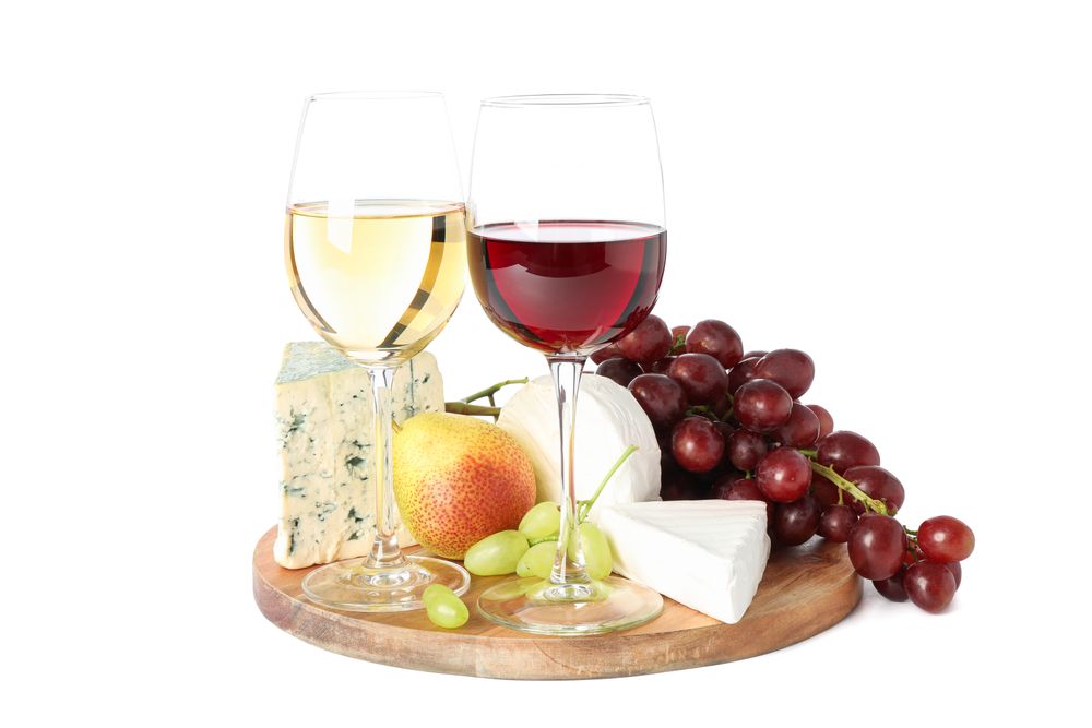Board, glasses with wine, cheese and fruits isolated on plain background
