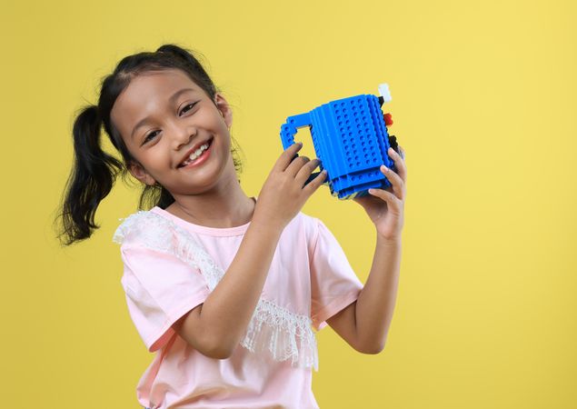 Asian Girl Kids Drink Water from Blue Cute Cup