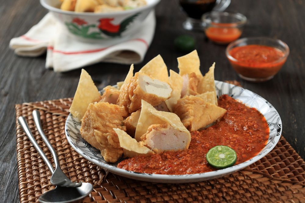 Close Up A Plate of Batagor or Baso Tahu Goreng with Spicy Peanut Sauce