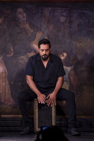 Hispanic man playing percussion
