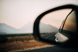 View of the mountains in the rearview mirror