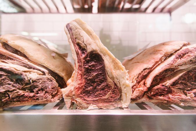 Raw meat on a butcher's chiller for maturing
