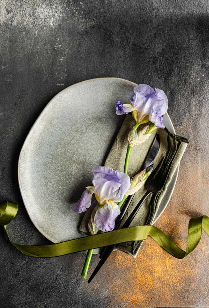 Table setting with pale blue iris flowers