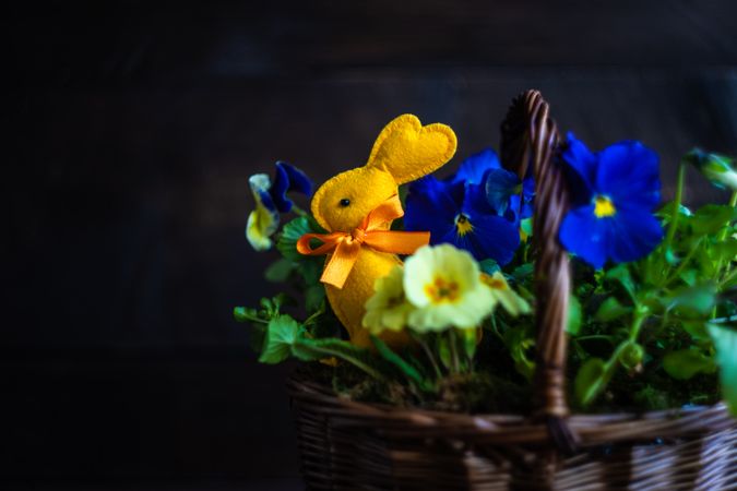 Basket of flowers with rabbit decoration