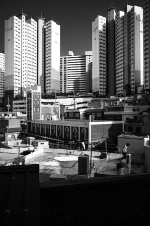Grayscale photo of city buildings in Busan, Busan, South Korea
