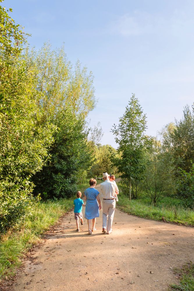 Grandparents and grandchildren walking outdoors