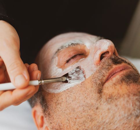 Man getting facial treatment