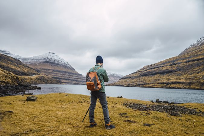 Back view of man photographing outdoors