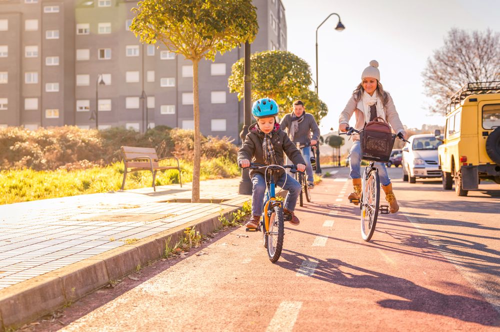 Man and woman taking little girl for bike ride