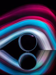 Crystal ball on board near abstract shines