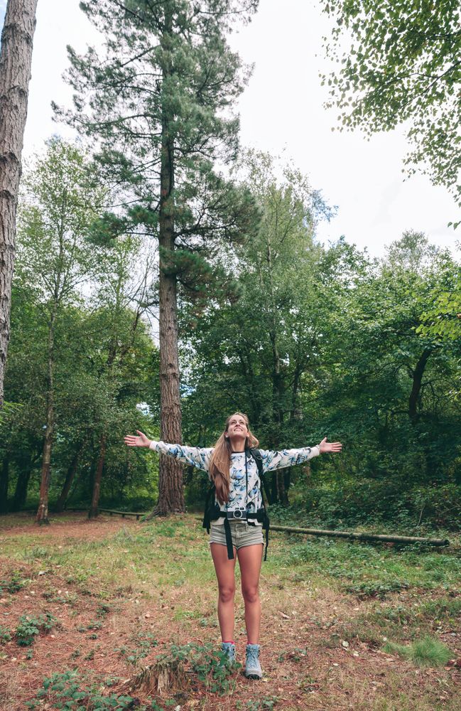 Female hiker with outstretched arms