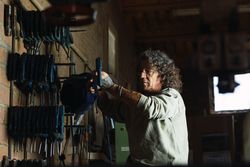 Man using carpentry tool in workshop