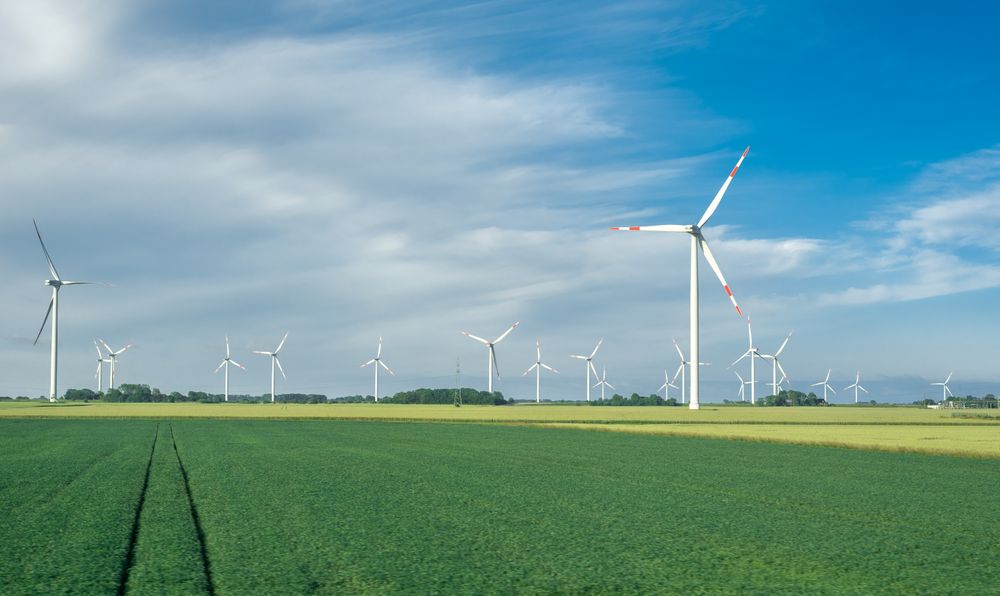Windmill park, landscape on a sunny day, in North Sea, Germany