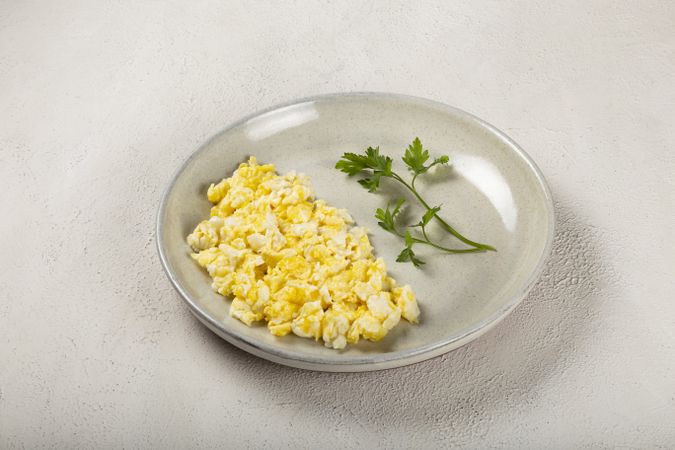 Breakfast with scrambled eggs on the table.