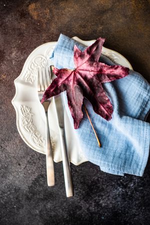 Place setting with grape leaf