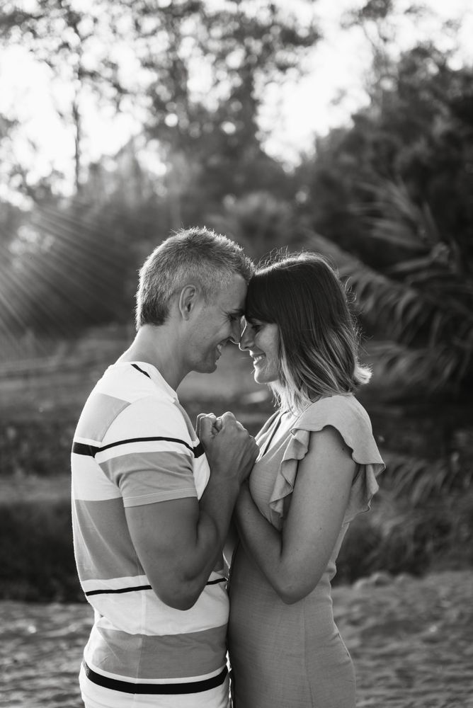Happy couple looking at each other on beach