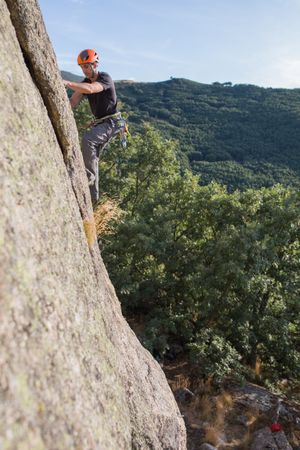 Man climbing a rock