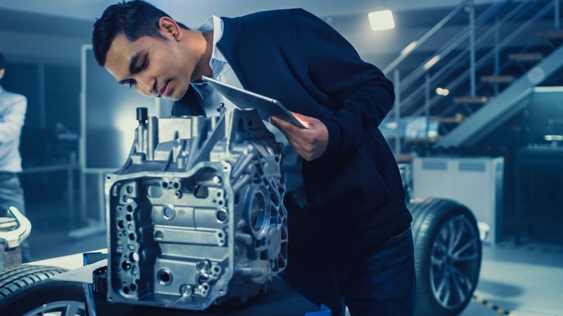 Development Laboratory Room with Professional Automotive Design Engineer Working on a Electric Car Gear Transmission.