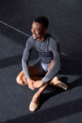 Photo portrait of a Black male dancer clothes and slippers and ballet in a dance academy
