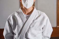 Woman in mask wearing kimono
