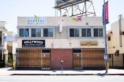 Sidewalk businesses with plywood over windows after riots