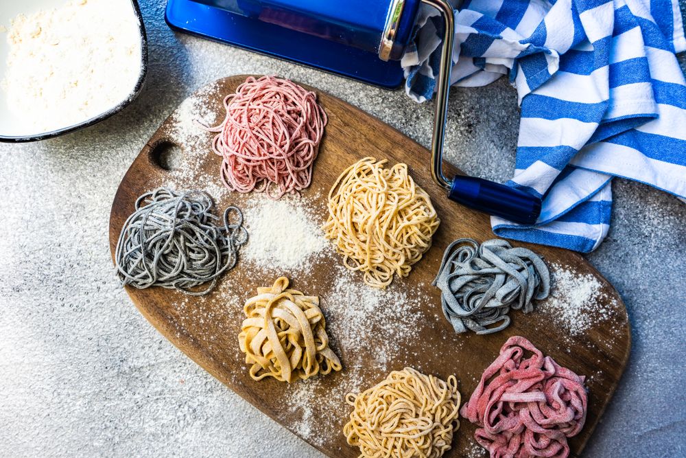 Top view of Italian homemade pasta on cutting board
