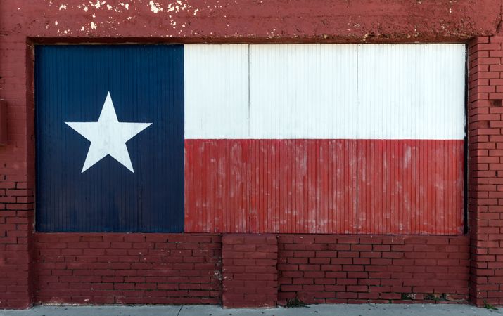 Texas flag, painted on boarded-up window in Brownwood, Texas
